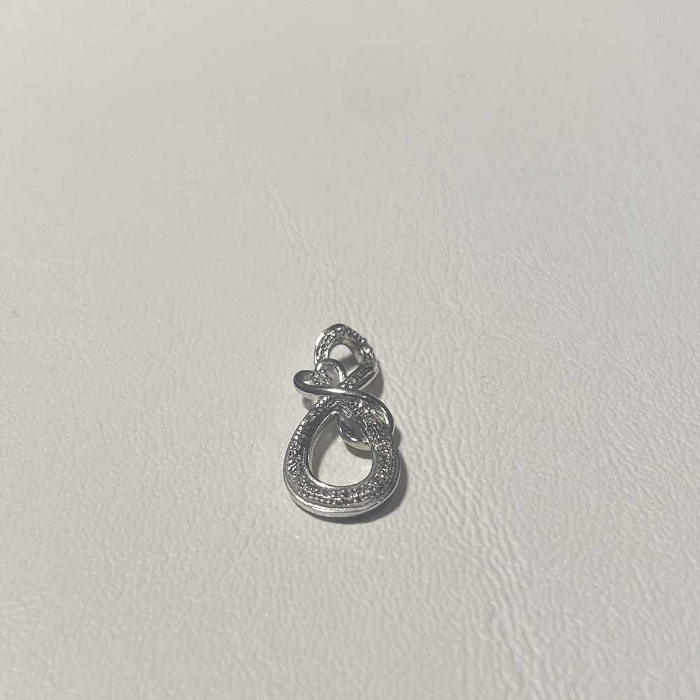 Mother and child diamond infinity sterling silver pendant.